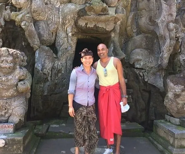 Visitors at the carved entrance of Goa Gajah, the Elephant Cave temple
