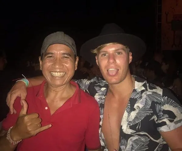 Ketut laughing with a happy traveller during a Bali tour